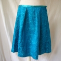 We added a satin waistband and cut the skirt pattern from the off-cut